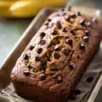 Close-up of chocolate espresso banana bread with a rich, moist texture.