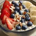 Close-up of a colorful Cottage Cheese Protein Power Bowl with fresh vegetables and herbs.