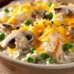 Close-up of a creamy chicken casserole with golden crust and herbs
