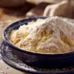Close-up of freshly baked bread without yeast on a wooden surface