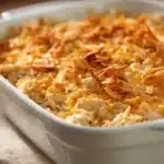 Close-up of a chicken hash brown casserole with golden crust and creamy texture.