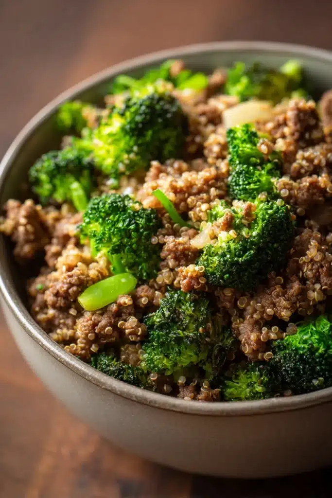 Close-up of ground beef and broccoli fried quinoa with vibrant colors