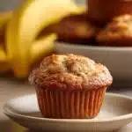Close-up of freshly baked Kodiak Cakes banana muffins on a clean white background.
