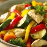 Close-up of a low calorie chicken and vegetable dish with vibrant colors and fresh ingredients.