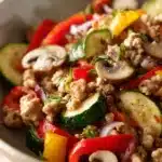 Close-up of a low carb dinner with ground turkey garnished with herbs