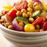 Close-up of roasted chickpeas and vegetables with bright colors and clean background
