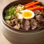 Close-up of slow cooker beef ramen noodle with vibrant vegetables and rich broth
