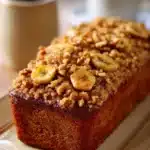 Close-up of banana bread with brown sugar streusel on a clean background