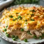 Close-up of a creamy tuna noodle casserole in a pan with noodles and sauce