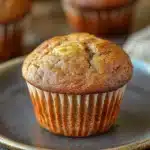 Close-up of banana muffins on a wooden board, perfect for a snack.
