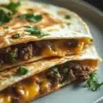 Close-up of a high protein ground beef quesadilla with melted cheese and crispy tortilla
