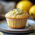 Close-up of a lemon poppyseed muffin with a bright, appetizing appearance.