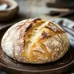 Close-up of no knead bread dough on a wooden surface with flour dusting