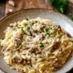 Close-up of one pot creamy orzo and beef with a warm, appetizing presentation.