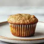 Close-up of paleo banana zucchini muffin with a warm, inviting texture