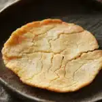 Close-up of thin and crispy cookies on a clean white background.