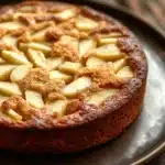 Close-up of a delicious apple cake with a golden crust, perfect for toddlers.